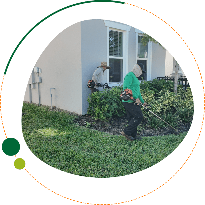 Commercial landscaping Davenport FL crew providing HOA lawn and landscape maintenance with edging and shrub trimming